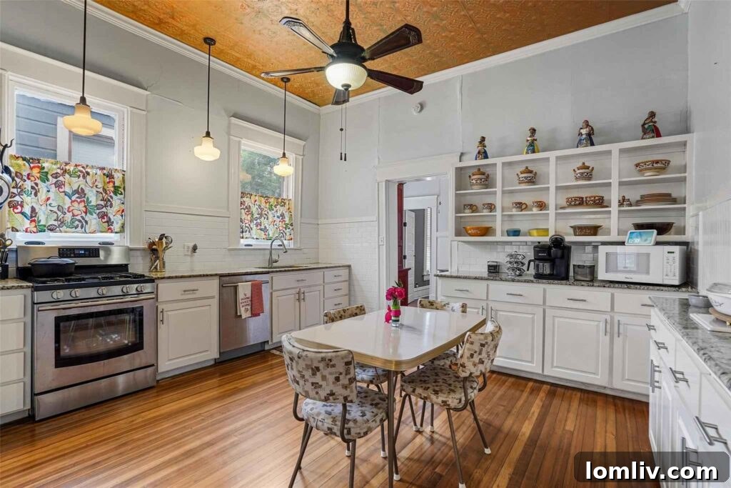 Vintage-Inspired Eat-in Kitchen with Beadboard Ceiling and Schoolhouse Lights