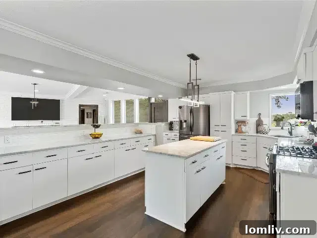 Elegant dining area adjacent to kitchen in renovated Fort Worth home
