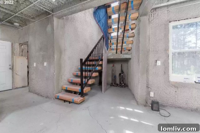 Concrete interior hallway with natural light