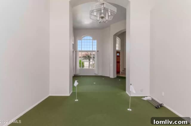 Dad practicing putting on the indoor golf green