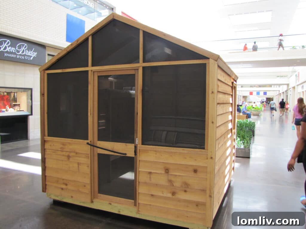 Another perspective of a detailed playhouse crafted by the Butscher family, showcasing their commitment to Dallas CASA.