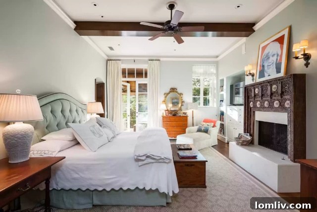 Primary suite balcony overlooking serene rear grounds and swimming pool