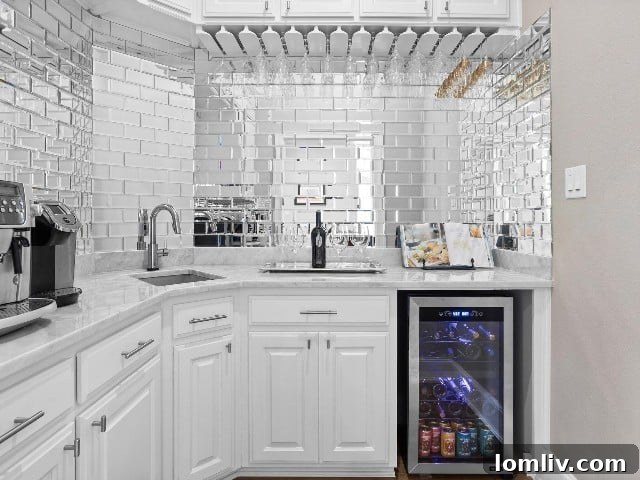 Wet bar with subway tile backsplash in luxury home