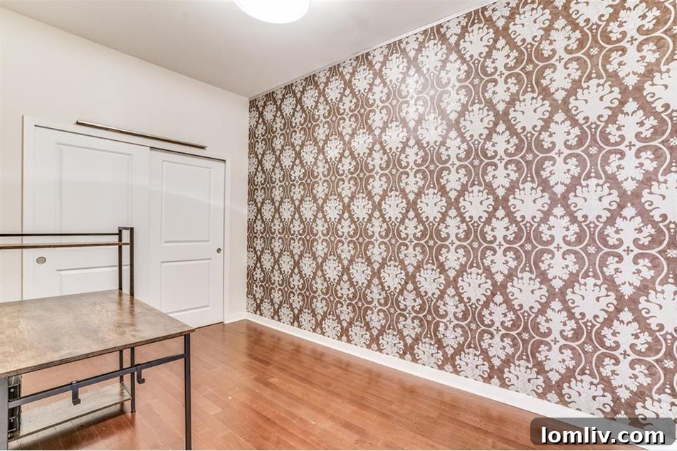 Urban Elegance Redefined: A Highrise Haven in the City 7 A spacious and elegant bathroom featuring beautiful tile work and contrasting wood cabinetry.