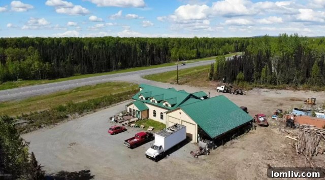 The unique and rustic entrance to the Talkeetna property, featuring repurposed elements.
