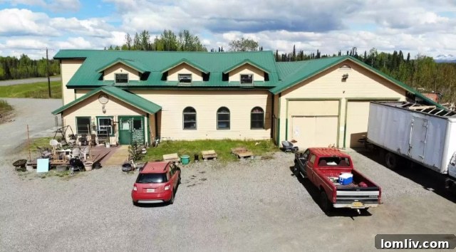 A creative outdoor dining area with picnic tables made from tire rims on the Talkeetna property.