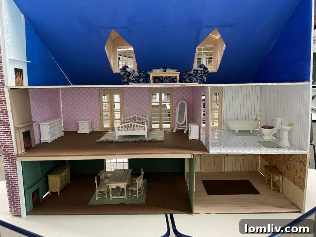 The scaled dollhouse fits within the LLCI-built playhouse