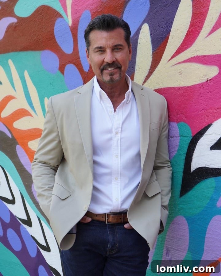 Turtle Creek Association Takes Charge of Dallas Front Yard Beauty 4 J.D. Trueblood standing proudly in front of a vibrant mural beneath the Lemmon Avenue Bridge, an artistic enhancement to the Turtle Creek area.