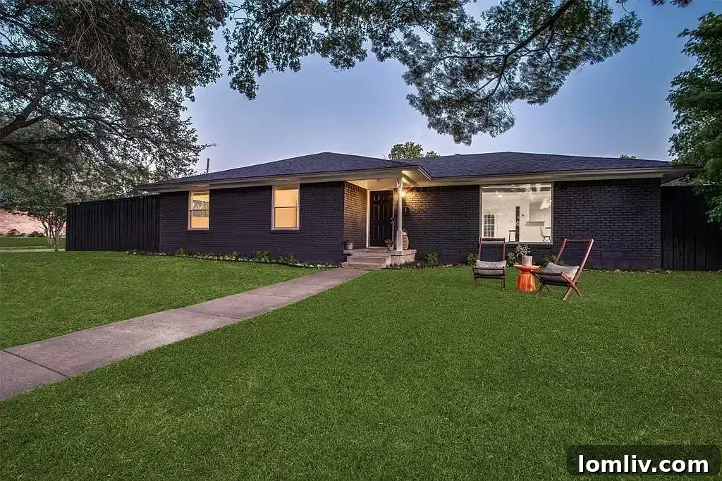 Poolside Perfection: Everything About This Home 3 Expansive backyard with a modern pool and outdoor lounging space in Richardson, TX