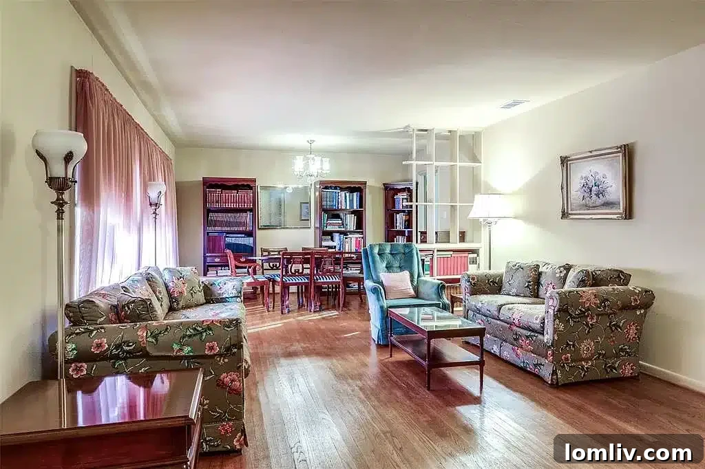 Interior view of the living room at 9922 Donegal Drive with original hardwood floors