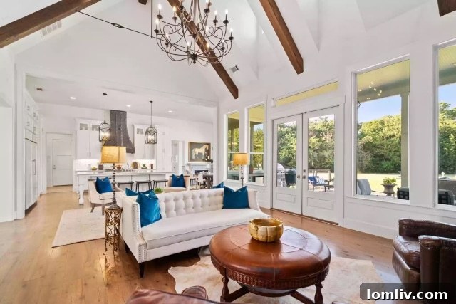 Luxurious farmhouse kitchen featuring a large island, custom cabinetry, and high-end appliances