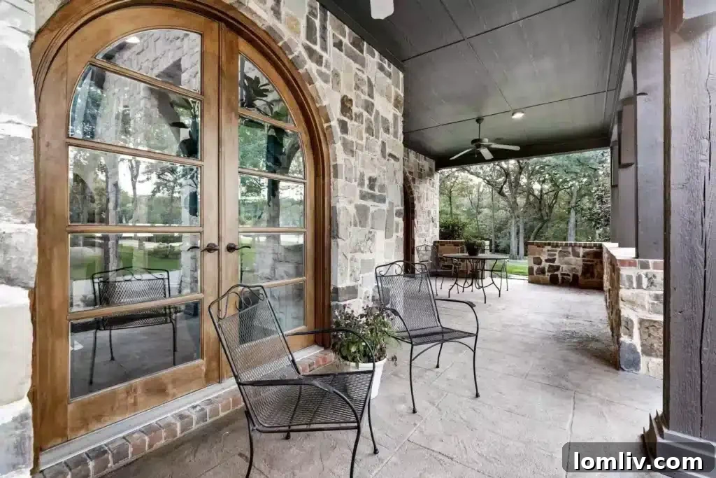 A Flower Mound Fairy Tale Home 14 Outdoor Kitchen and Bar Area with Alfresco Dining