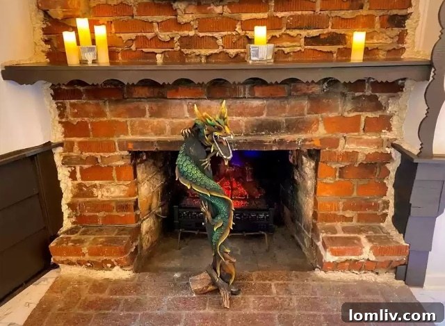 A detailed close-up of the impressive dragon sculpture integrated into the fireplace design, showcasing its intricate scales and fierce expression.