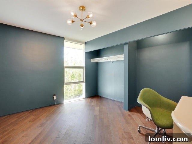Upstairs bedroom in Hood Street condo, featuring diagonal engineered hardwood flooring