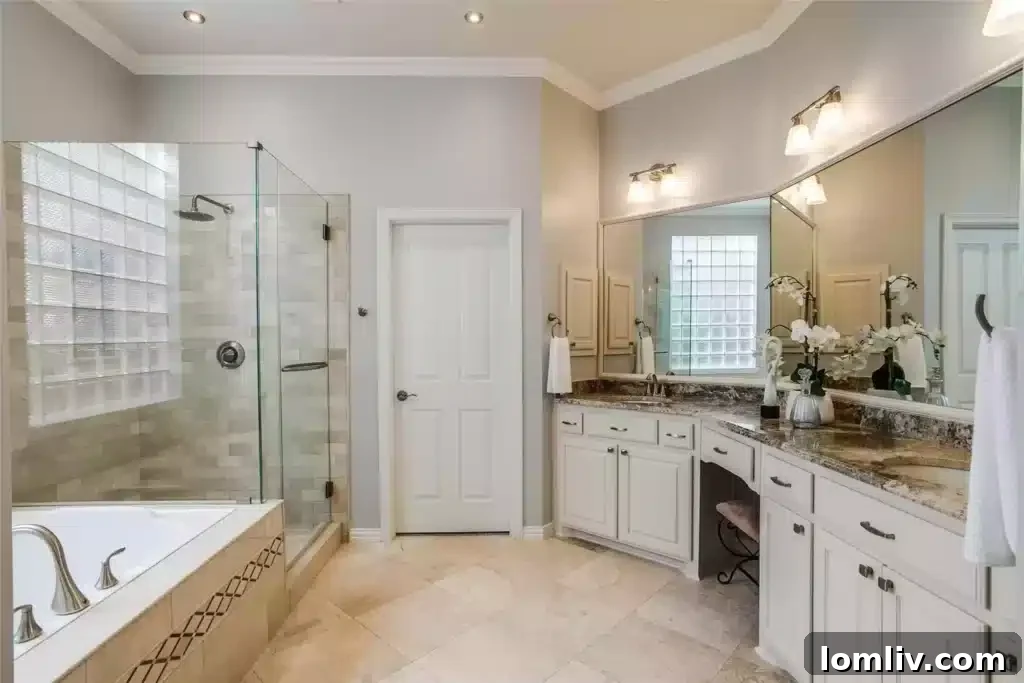 Primary Bathroom with Travertine and Marble Finishes