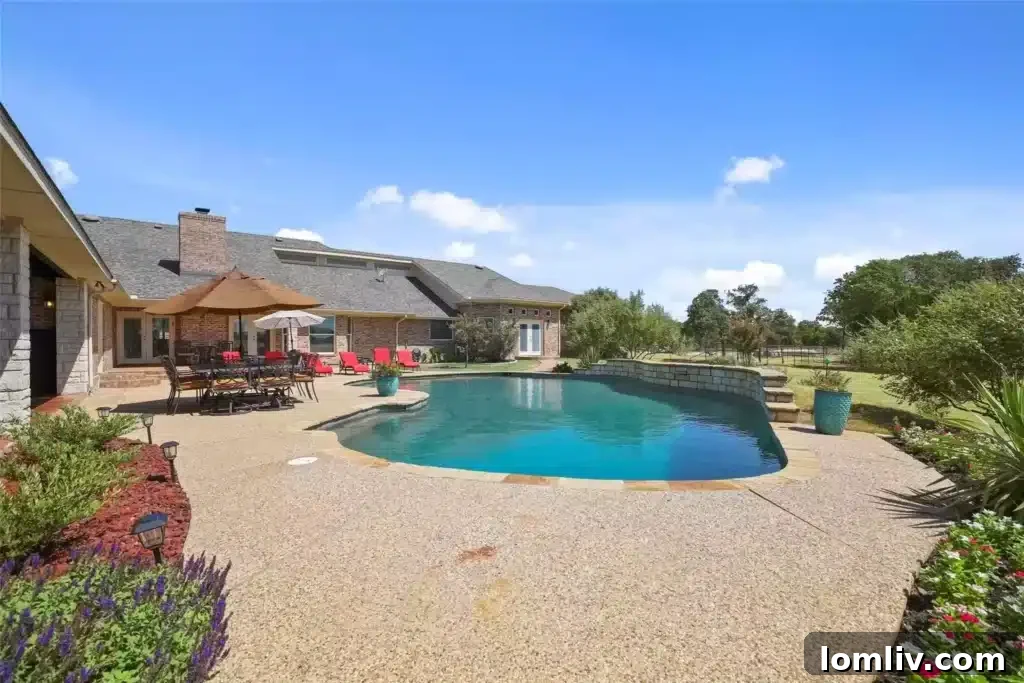Full Outdoor Kitchen with Built-in Grill and Ample Counter Space in Burleson Estate