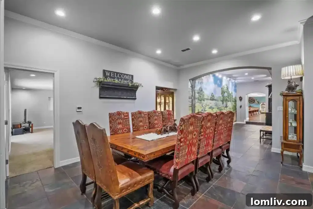 Modern Gourmet Kitchen with Large Island and Stainless Steel Appliances in Burleson Residence