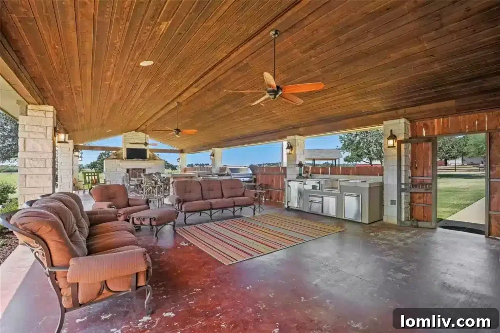 Expansive Outdoor Living Pavilion with Fireplace and Cedar Plank Ceilings at 10420 CR 1016