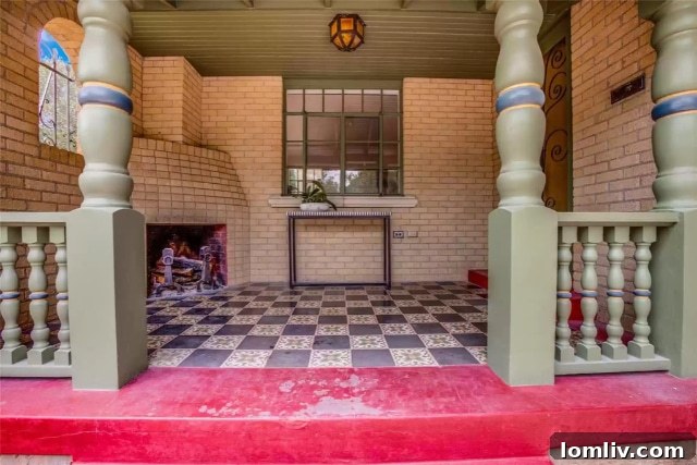 Own a Historic Hutsell Masterpiece in Lakewood 4 Exterior view of 6969 Lakewood Blvd, showcasing Spanish Eclectic architectural details