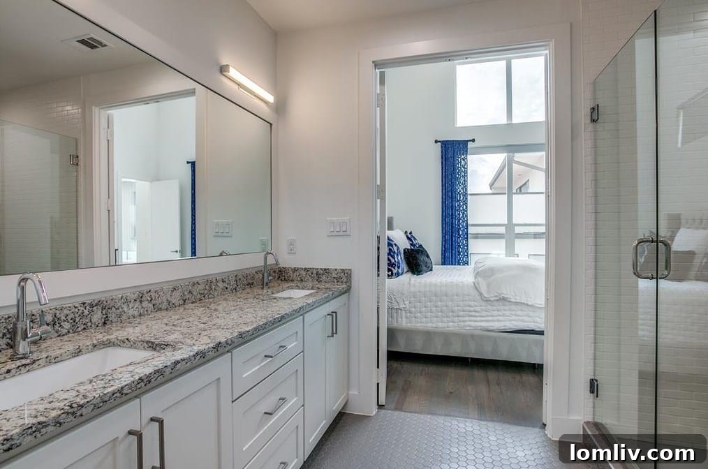The Townhome That Captivates 10 Primary Suite with Floor-to-Ceiling Windows and City View