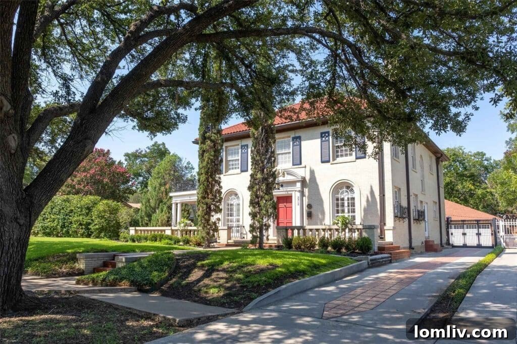 Grand Exterior of a 1926 Historic Villa in Fort Worth's Ryan Place, showcasing timeless architecture and lush landscaping