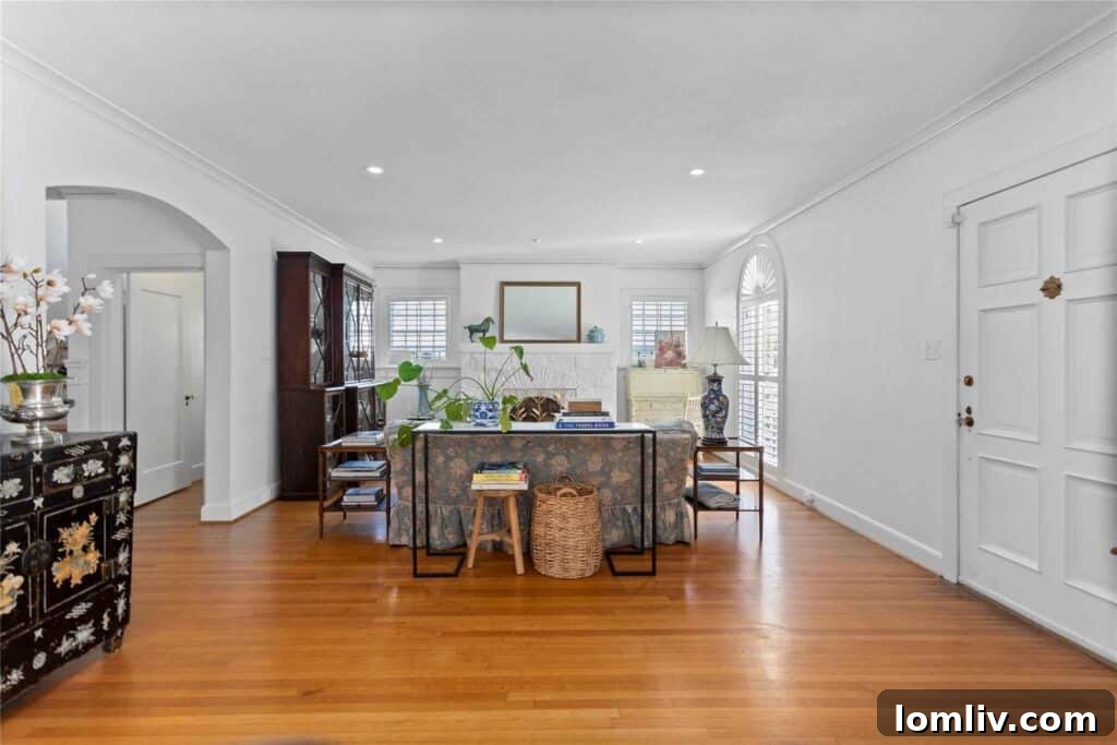 Bright and Inviting Living Room with Original Oak Hardwoods in a Fort Worth Historic Home