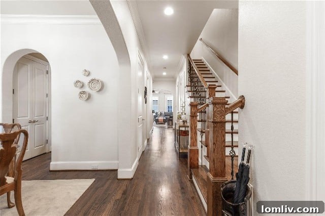 Elegant entry of a Brownstone townhome with a prominent staircase
