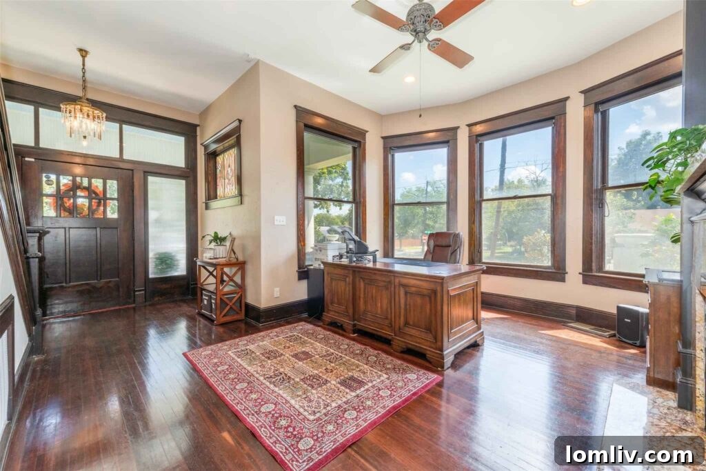 Grand vestibule with bay windows and fireplace in Chestnut House