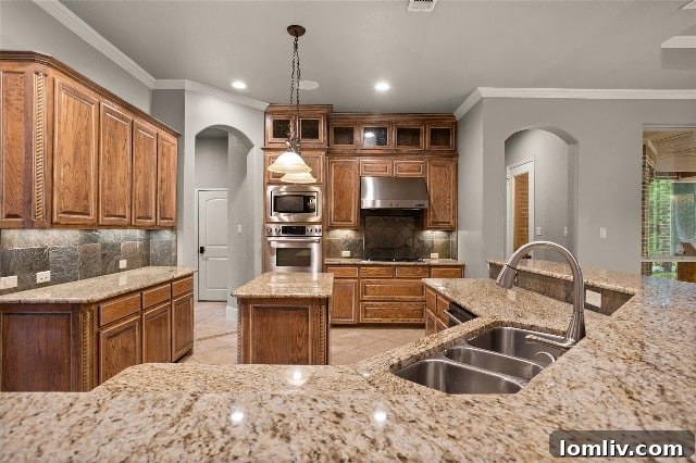 Gourmet Kitchen with Island in Luxury Benbrook Lake Home