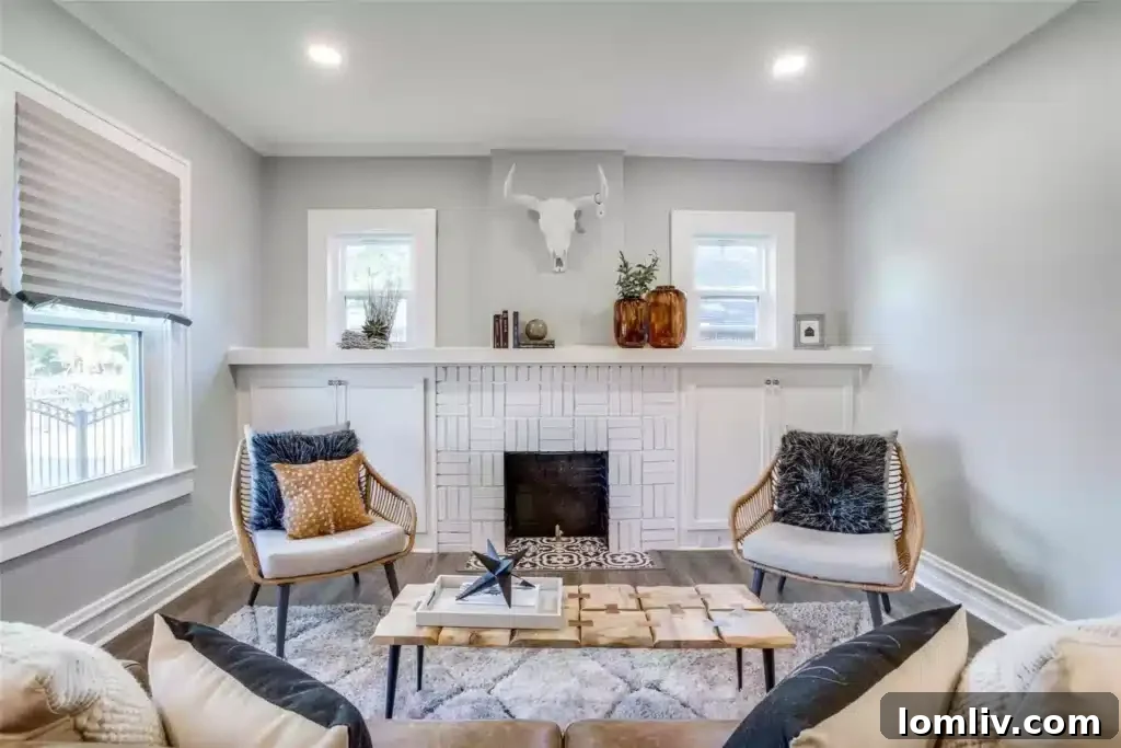 Expansive open-concept living room with original fireplace at 610 Cedar Hill Ave