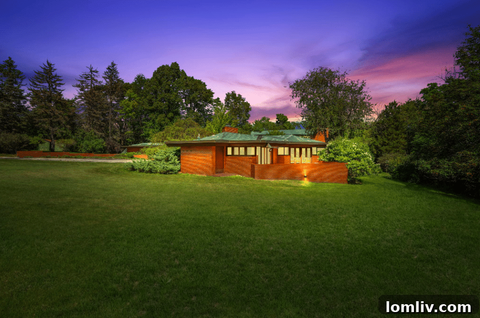The Keland House exterior, a classic Frank Lloyd Wright Usonian design, nestled in a natural setting in Mount Pleasant, Wisconsin