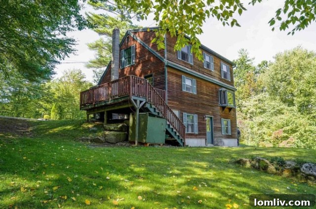 The exterior of a rustic yet charming house, set against a backdrop of dense New Hampshire woods, hinting at secluded living.