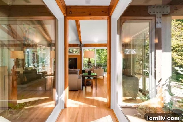 Floating glass bridge connecting living spaces at 5610 Farquhar Lane