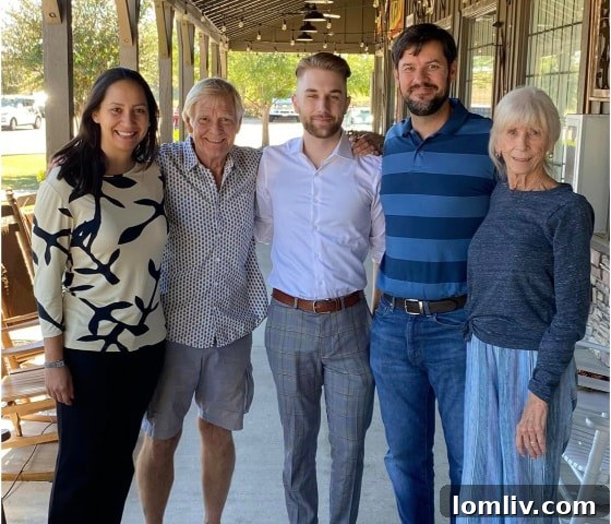 Jack Roth with his grandparents and home buyers