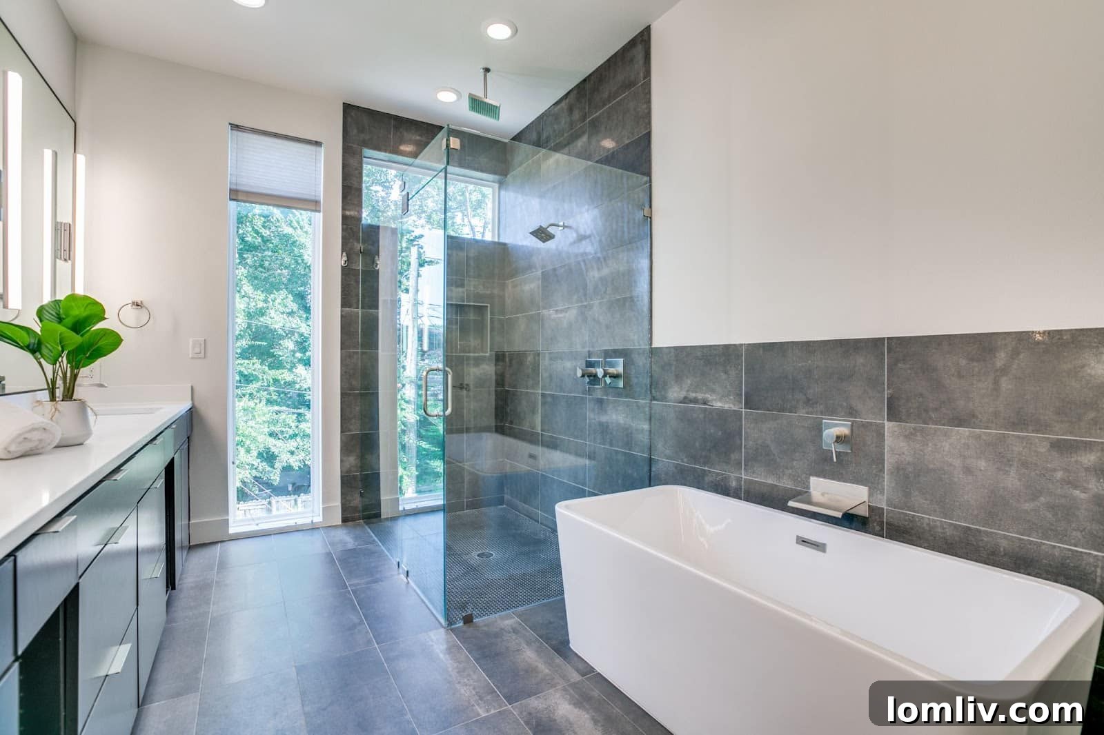 Bright and spacious bedroom with large windows, offering comfort and style in the Manett St duplex.