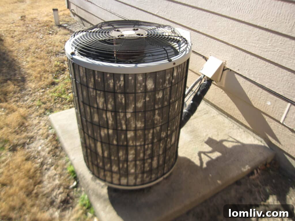 Close-up of an AC compressor coil showing severe hail damage
