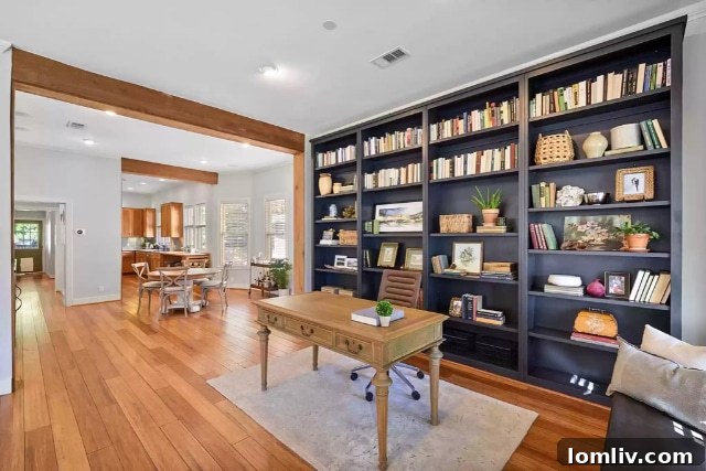 Living room with beamed ceilings and hardwood floors