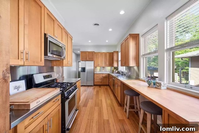 Stylish kitchen with stainless steel counters and appliances
