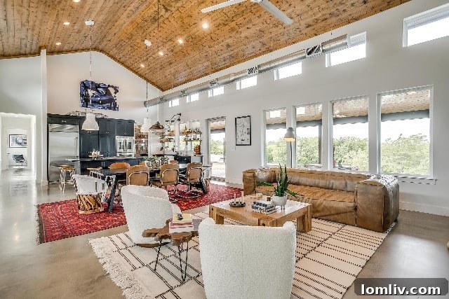 Grand great room with 18 ft high ceilings and abundant natural light in a modern farmhouse