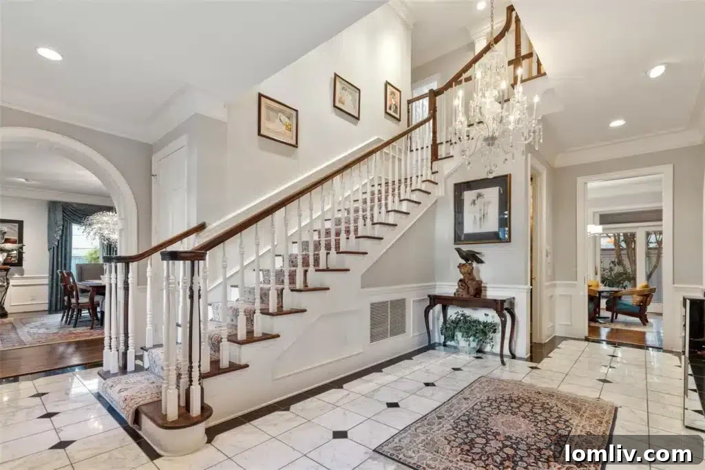 Grand foyer and staircase inside 3201 Greenbrier Drive