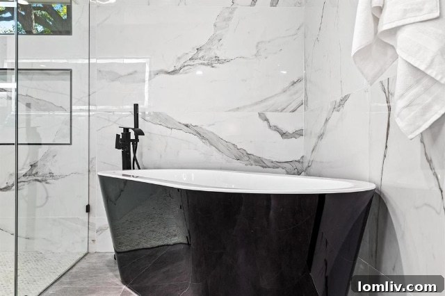 A contemporary bathroom vanity with dual sinks, modern fixtures, and ample lighting, reflecting the home's refined aesthetic.