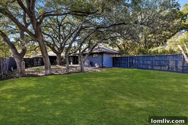 Another perspective of the renovated exterior, emphasizing the blend of classic Ranch architecture with modern updates and impeccable curb appeal.