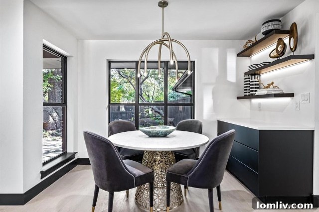 Elegant living area with thoughtful decor and abundant natural light, a hallmark of Niche Realty Group's luxury home renovations.