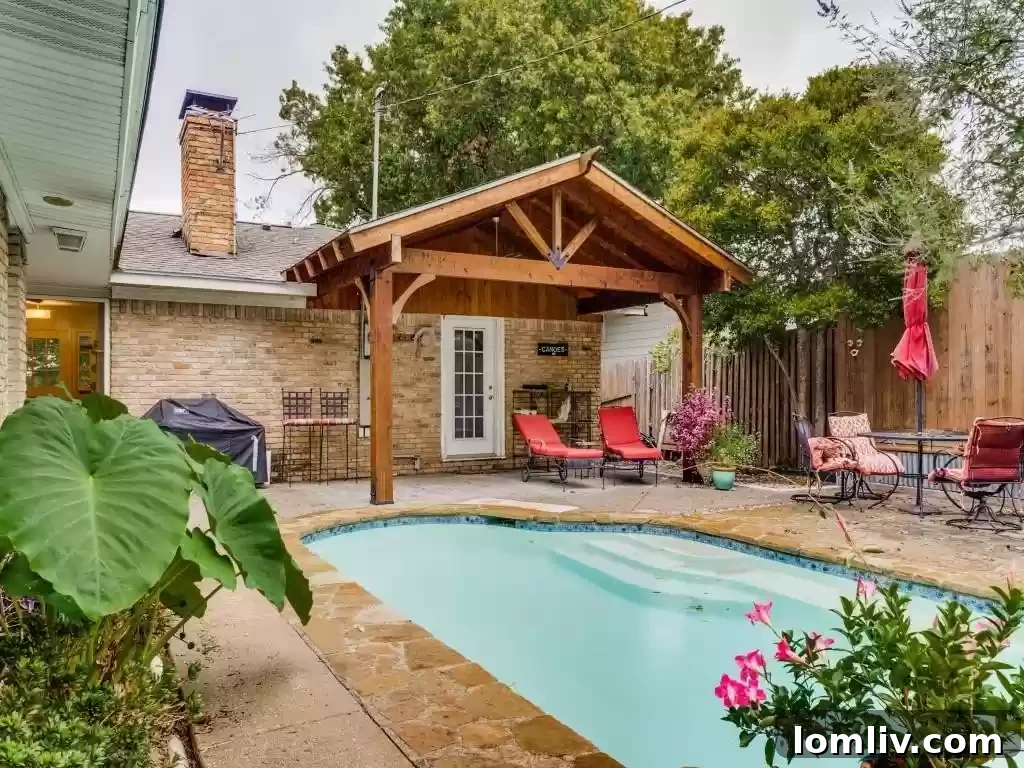 Spacious interior views connecting to the vibrant outdoor pool area of this East Dallas gem.