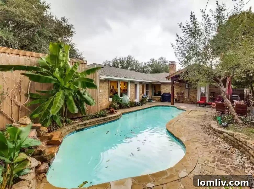 Gourmet kitchen with granite countertops, perfect for entertaining in your new East Dallas home with a pool.