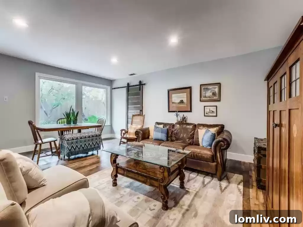 A serene bedroom offering comfort and style within this captivating East Dallas home.