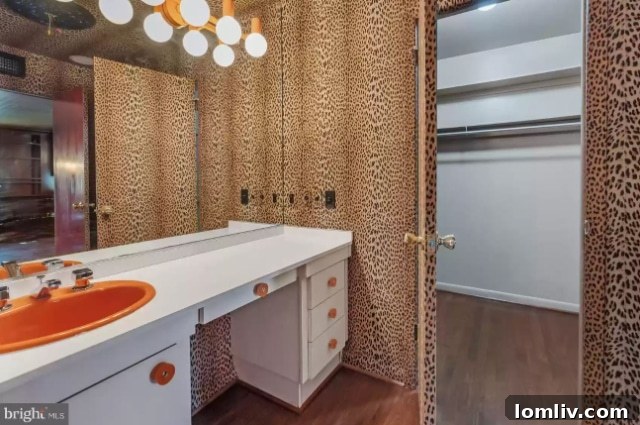 Vibrantly tiled bathroom with unique fixtures and yellow accents