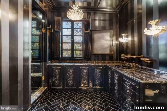Luxurious primary bathroom with ornate vanity and rich finishes