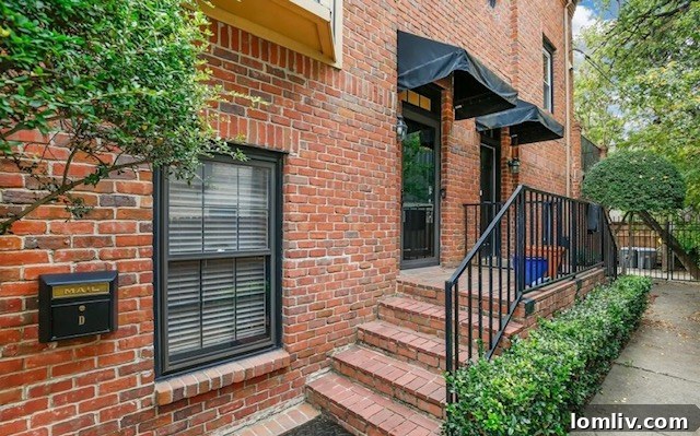 A charming apartment building facade at 4231 Holland Ave., Apartment D, listed for $420,000.