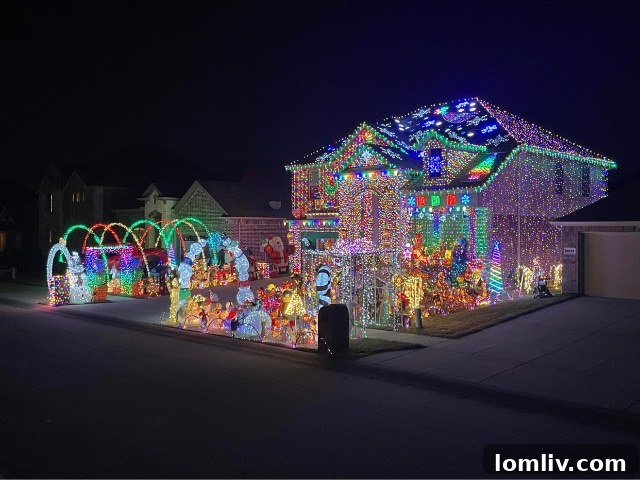 The Burkman Holiday Home at night, illuminated by an incredible density of Christmas lights, creating a magical and festive scene.